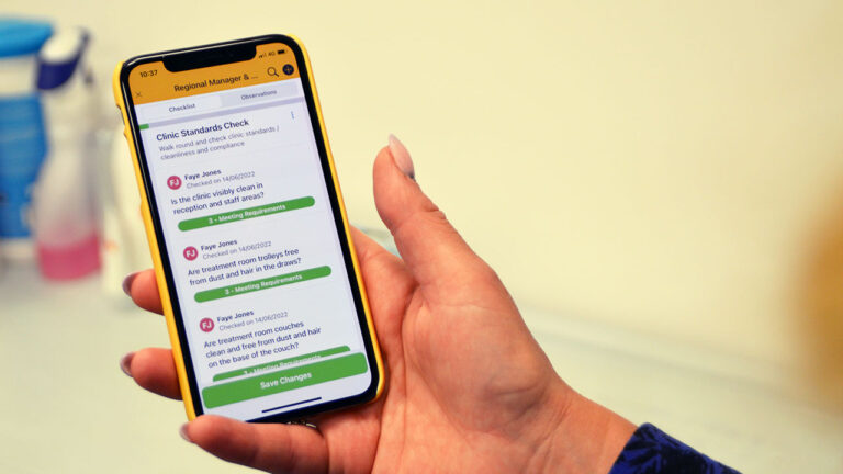 Person using the Work Wallet app for a clinic standards checklist