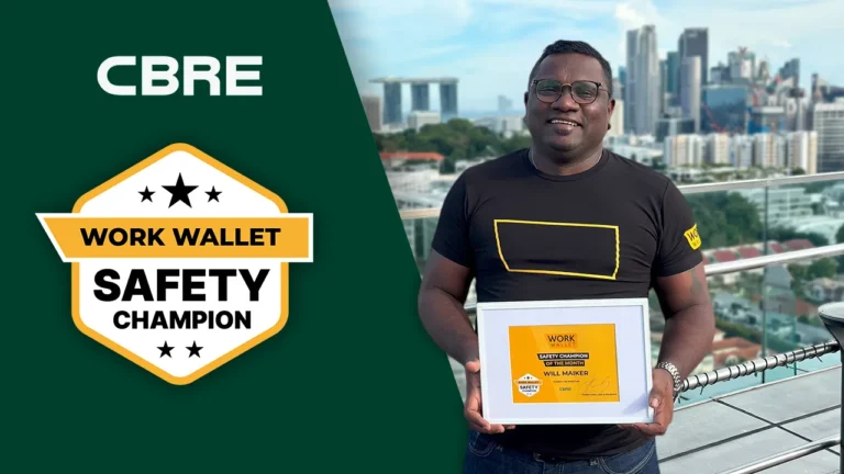 Man from CBRE holding a Work Wallet Safety Champion award