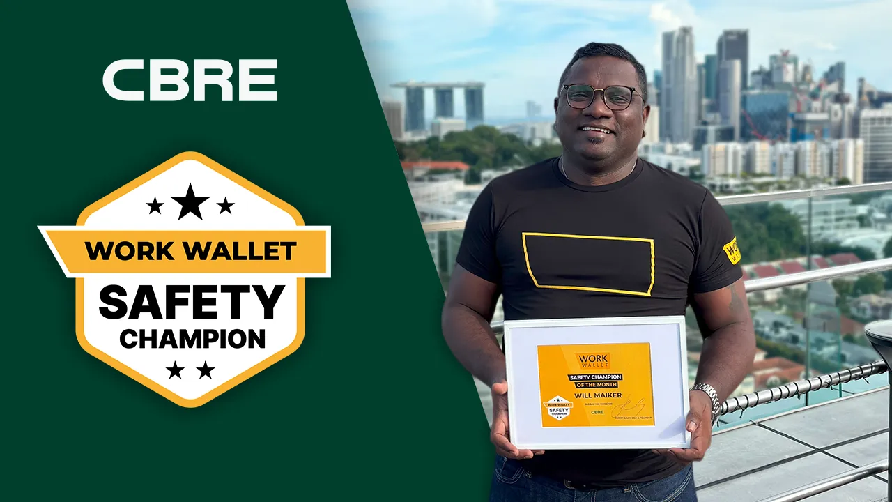 Man from CBRE holding a Work Wallet Safety Champion award
