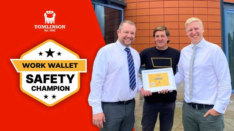 A Work Wallet team member presents a Work Wallet Safety Champion award