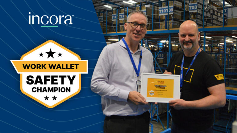 A Work Wallet team member presents a Work Wallet Safety Champion award