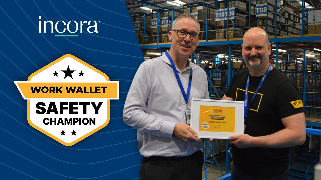 A Work Wallet team member presents a Work Wallet Safety Champion award