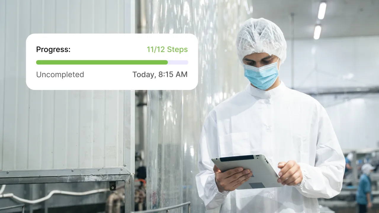 Worker in protective clothing using a tablet with progress tracking overlay