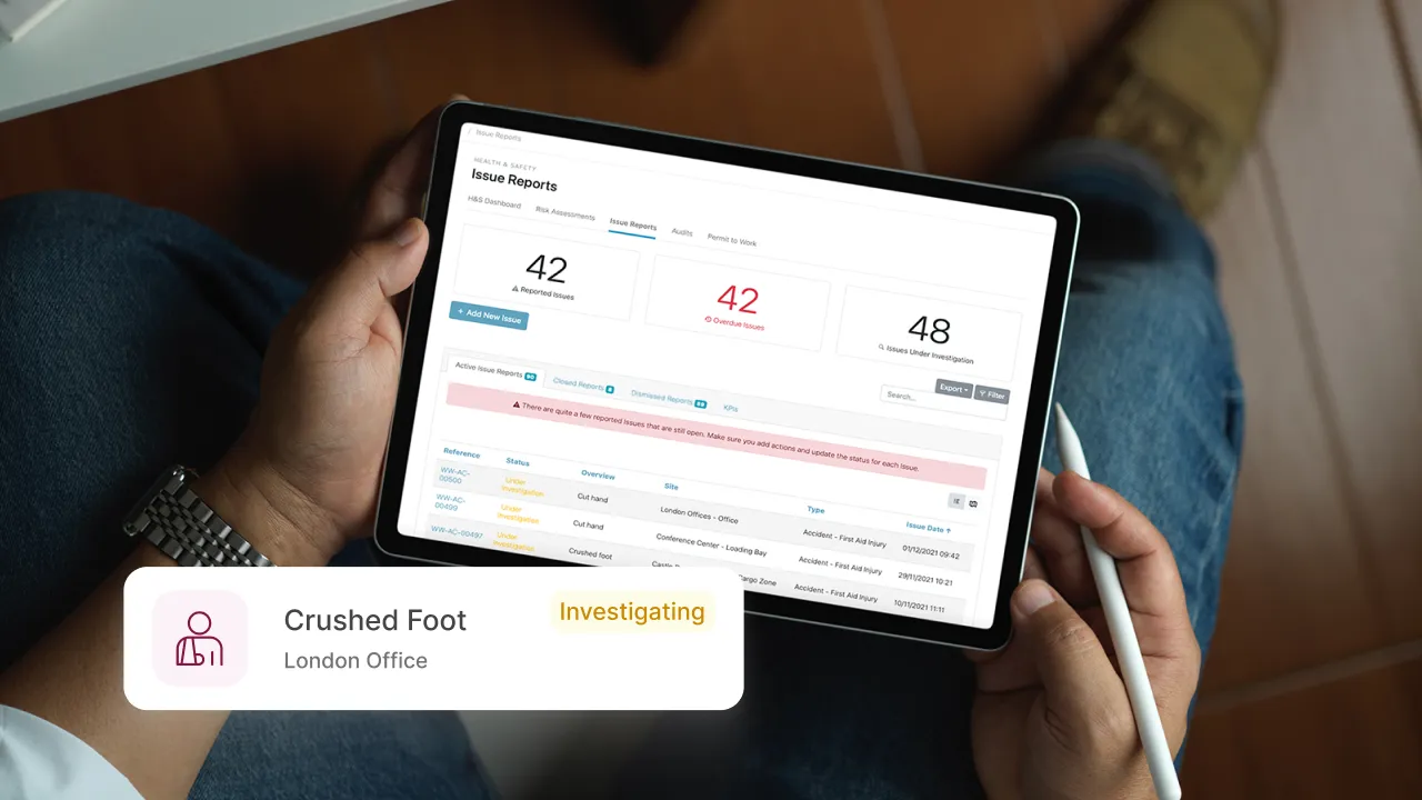 Person viewing Work Wallet issue reports dashboard on a tablet device