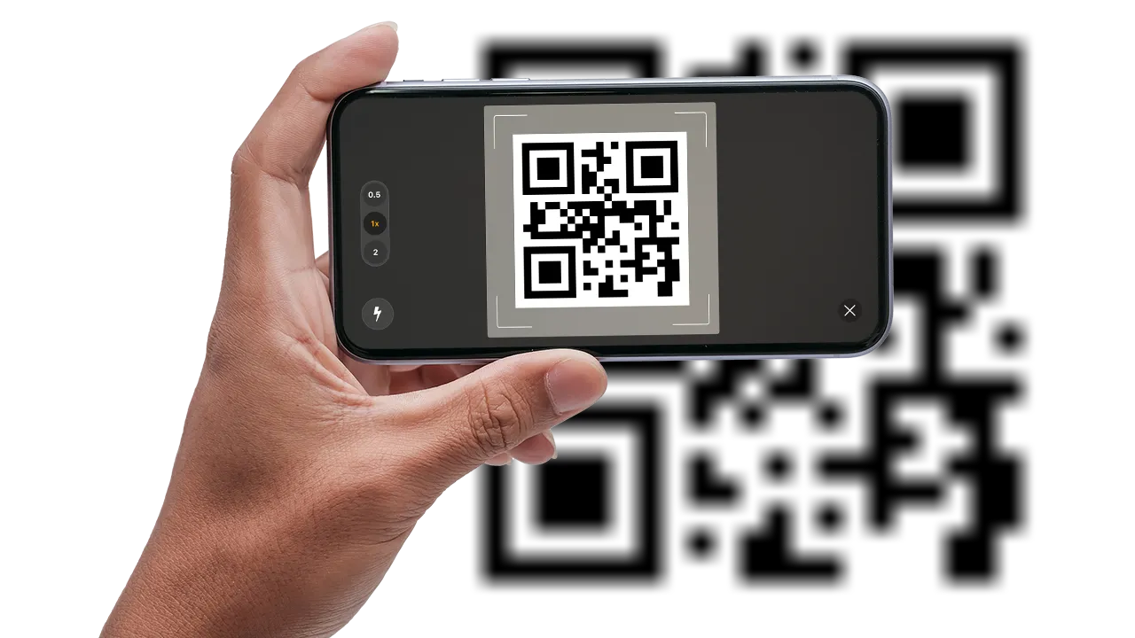 Hand holding a smartphone scanning a QR code on the screen