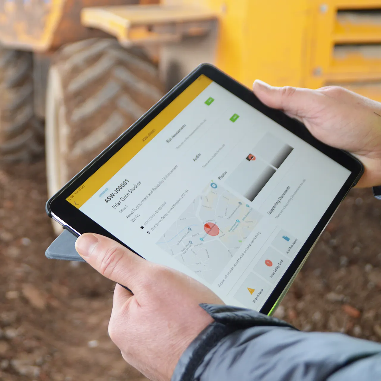 Person holding a tablet displaying a Work Wallet site screen